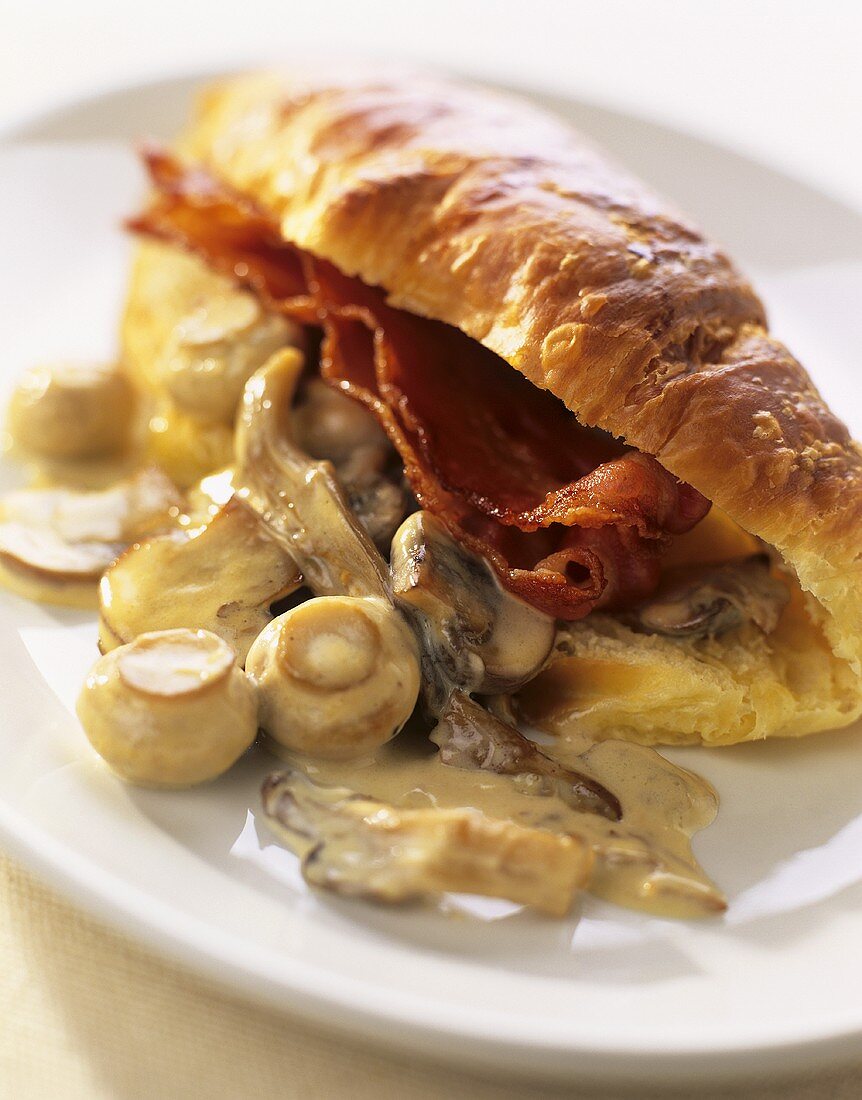 Croissant with mushrooms and bacon