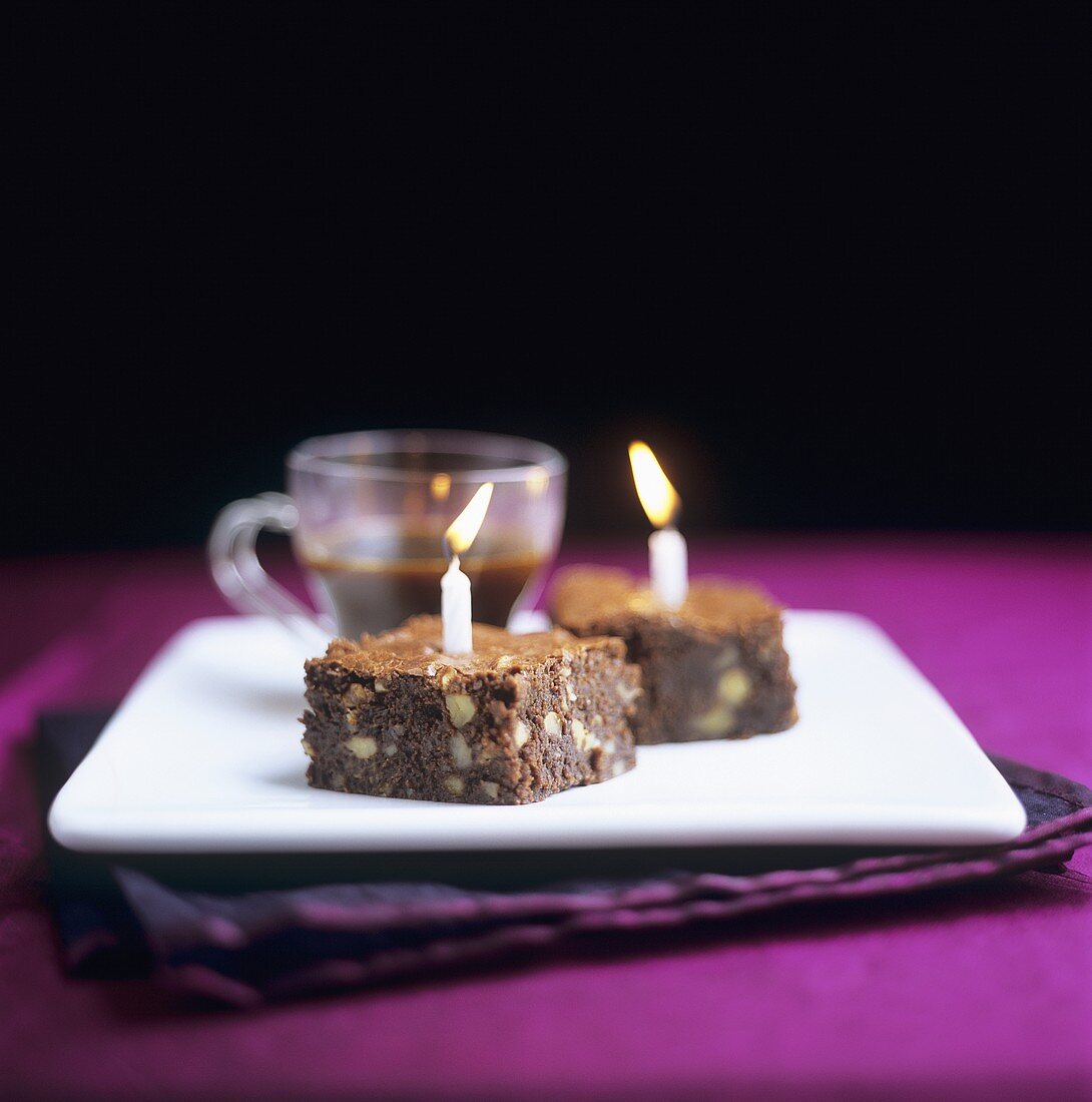 Two brownies with candles