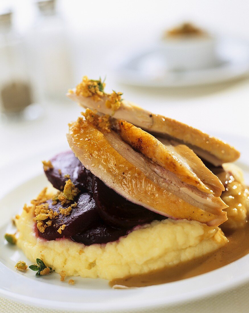 Roast chicken breast with beetroot on polenta