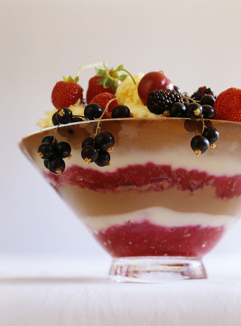 Layered dessert with fresh berries and ice cream
