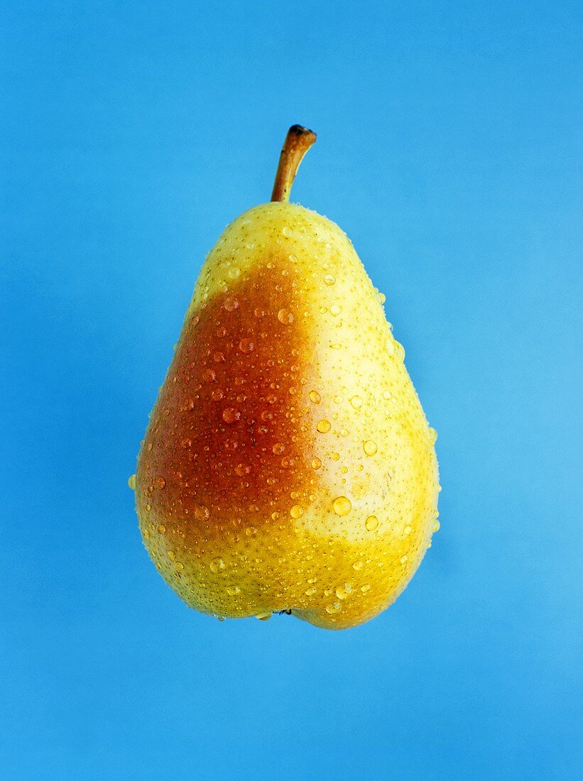 A pear with drops of water