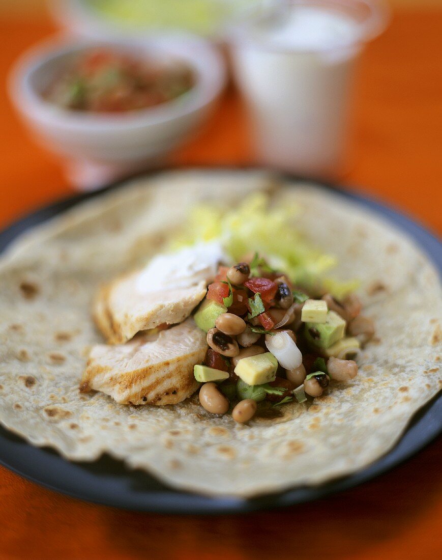 Wheat tortilla with chicken breast and vegetables
