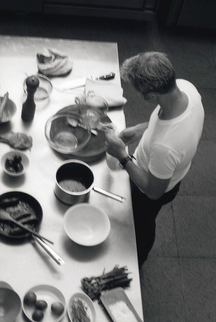 Young man preparing kitchen utensils and ingredients