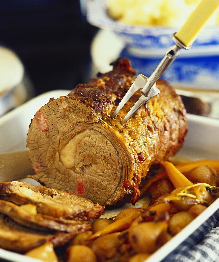 Rolled lamb roast with vegetables