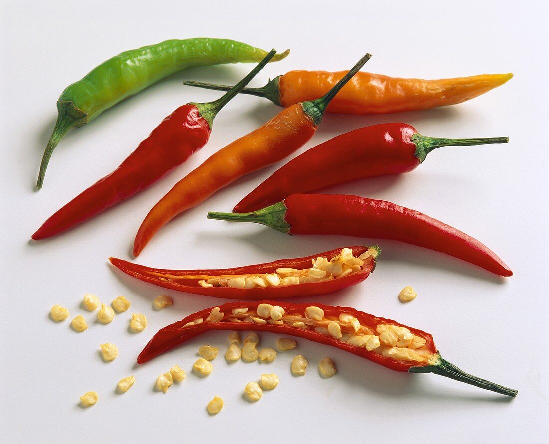 Chili peppers, whole and halved