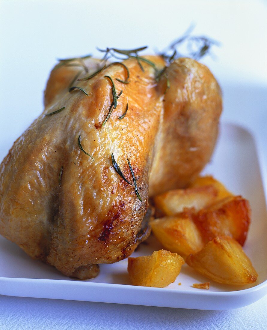 Roast guinea-fowl with rosemary and potatoes
