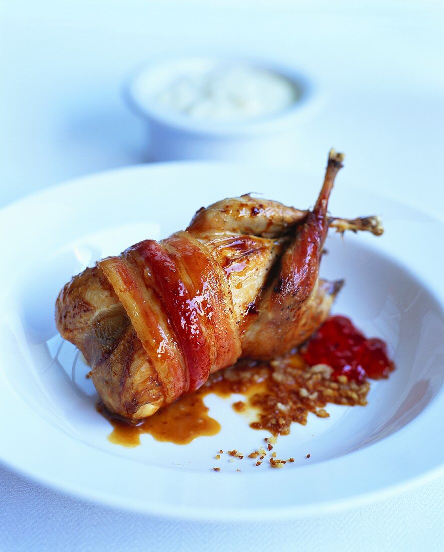 Partridge wrapped in bacon