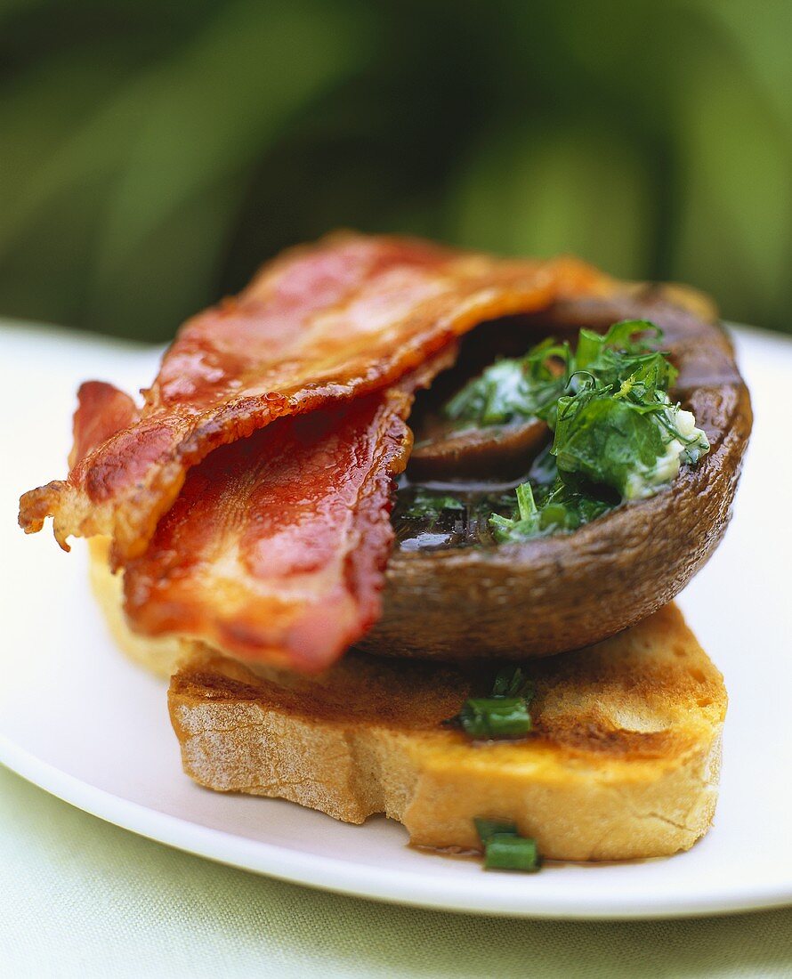 Bruschetta with fried mushroom and slices of bacon