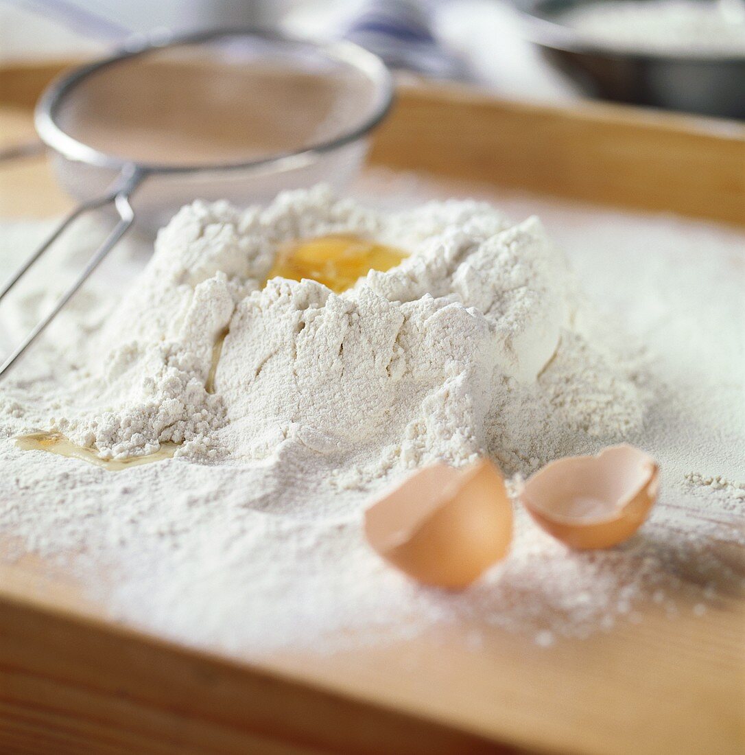 Egg broken into flour