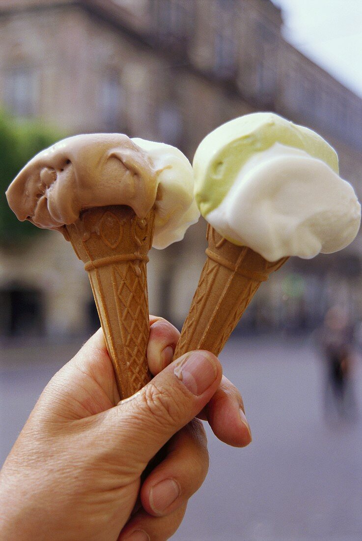 Two cones of soft ice cream