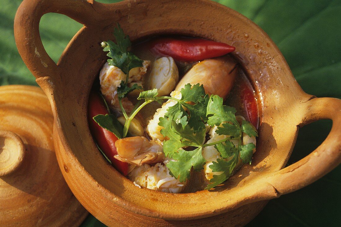 Seafood soup in terracotta pot (Thailand)