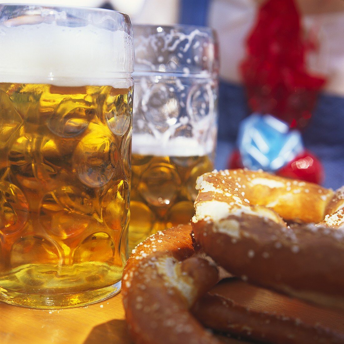 Tankards and pretzels on table (October Fest, Munich)
