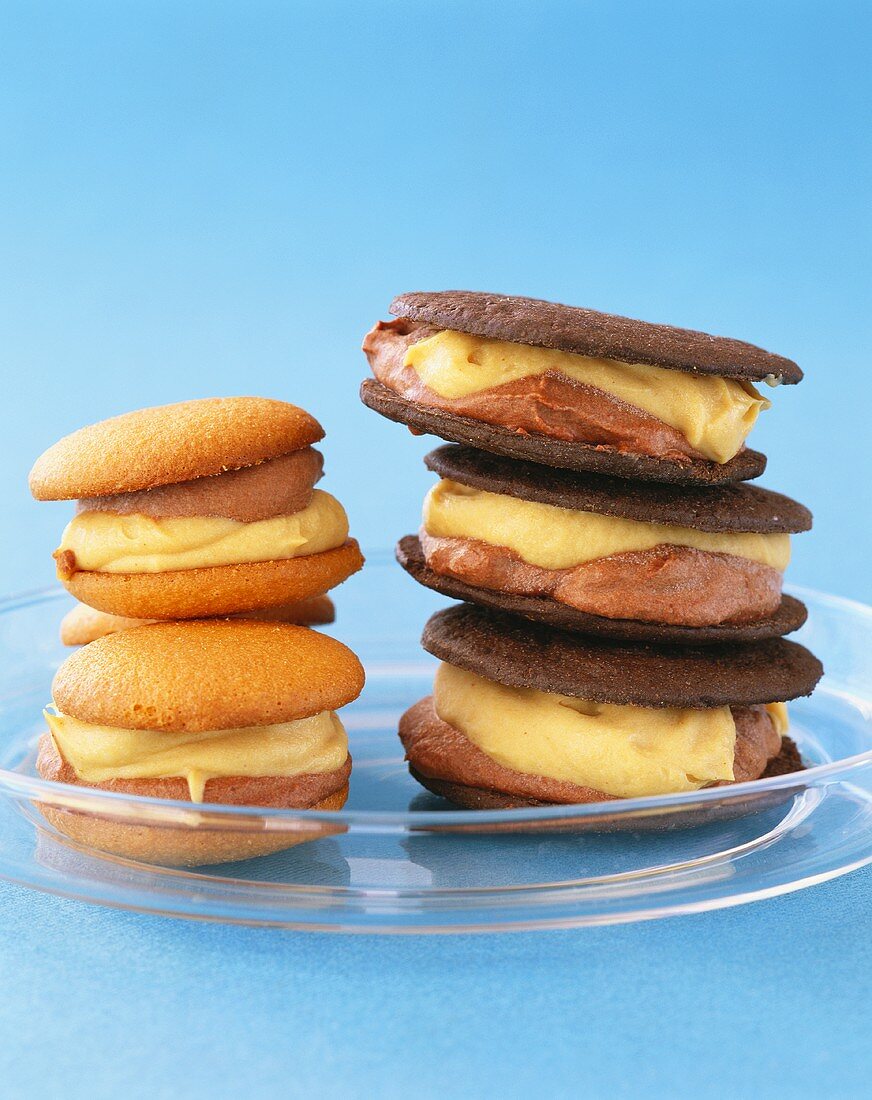Assorted biscuits with cream filling, in a pile