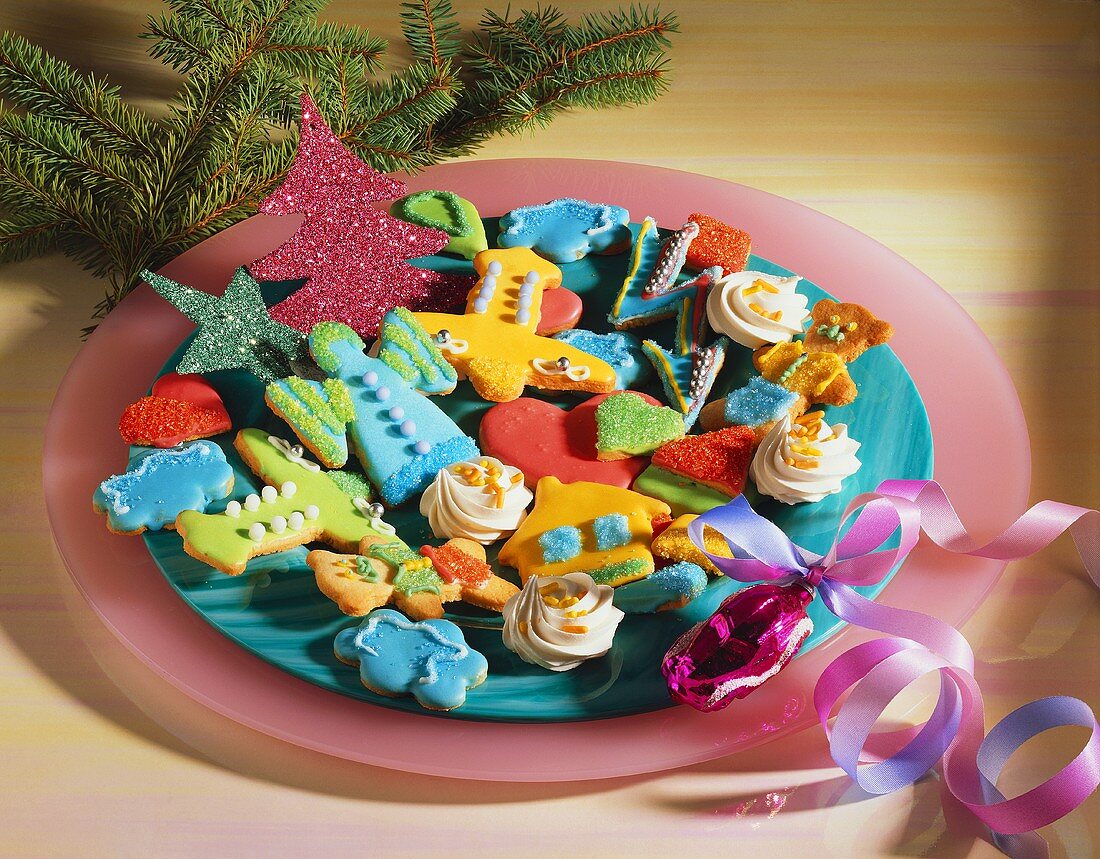 Assorted decorated Christmas biscuits on plate