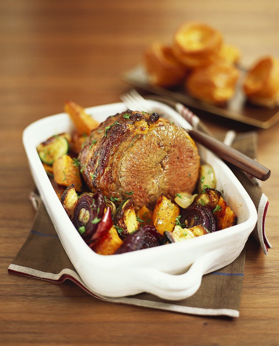 Braised beef with vegetables in roasting dish