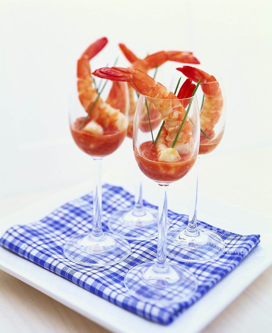 King prawns with horseradish and ketchup dip in wine glasses