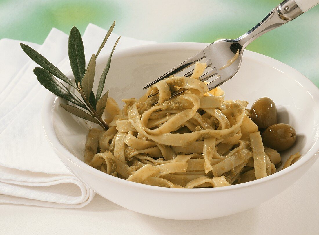 Ribbon pasta with green olives