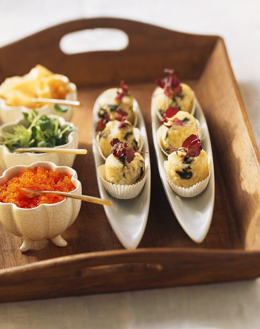 Japanese rice snacks with caviare, cress and ginger