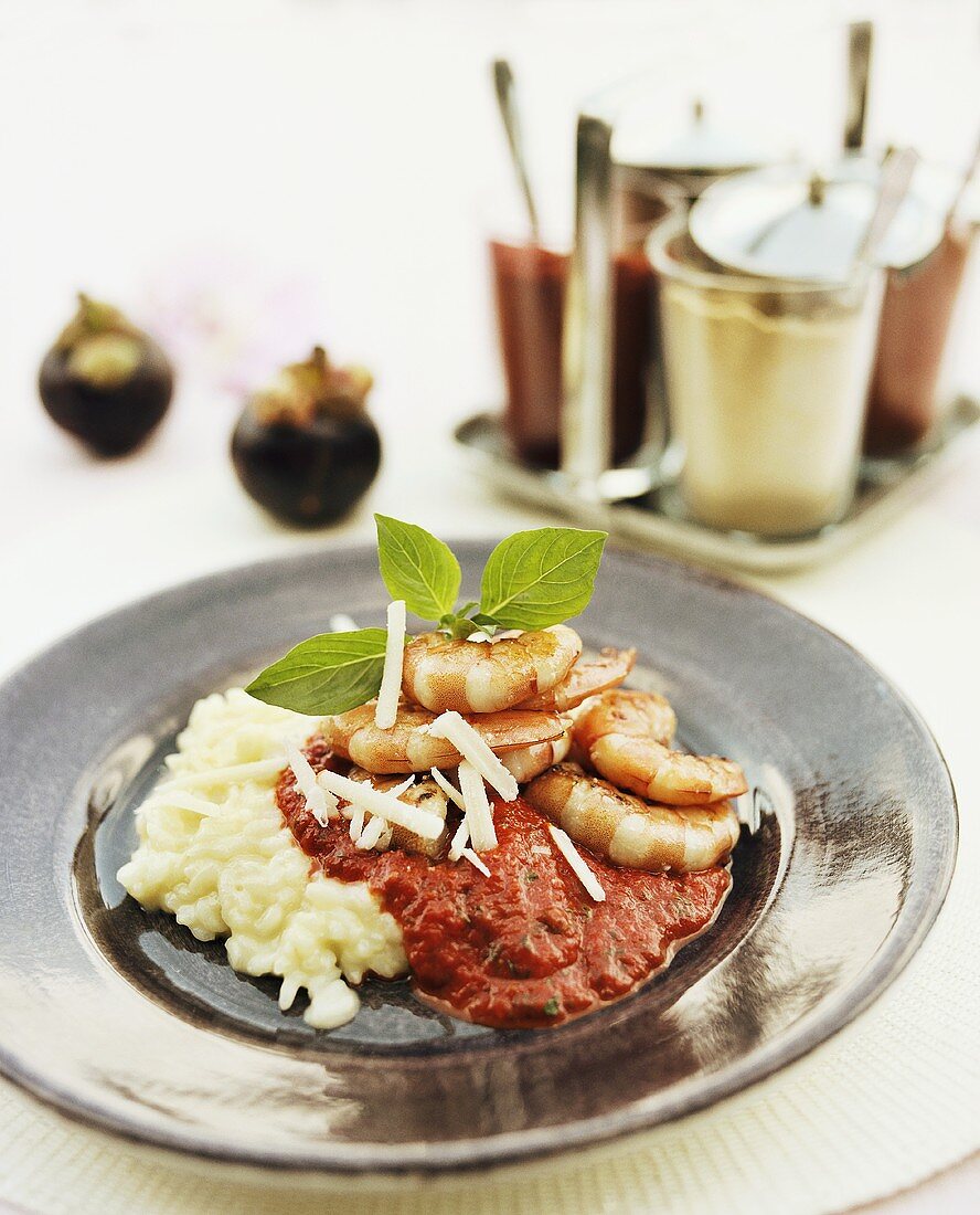 Prawns with risotto and tomato sauce