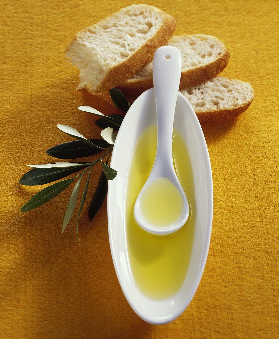 Olive oil, ciabatta and olive branch