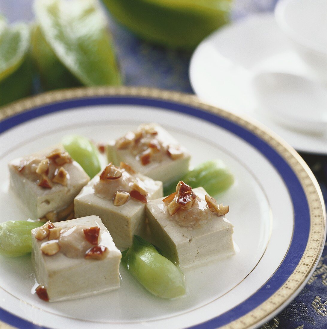 Tofu cubes with pork and lotus seeds (China)