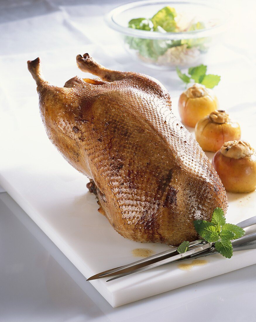 Roast young goose with stuffed apples