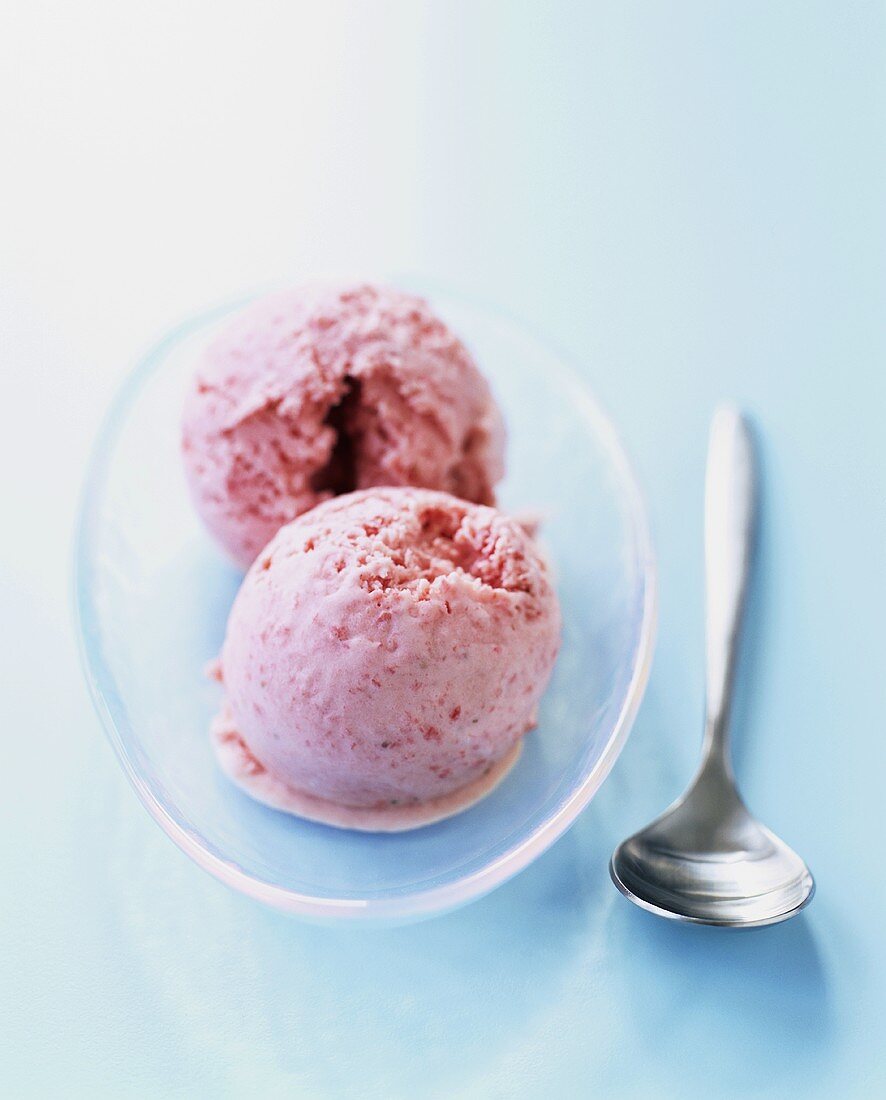 Two scoops of strawberry ice cream
