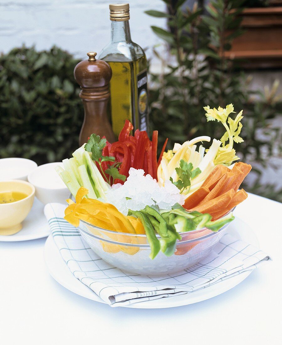 Crudités in glass bowl with various dips
