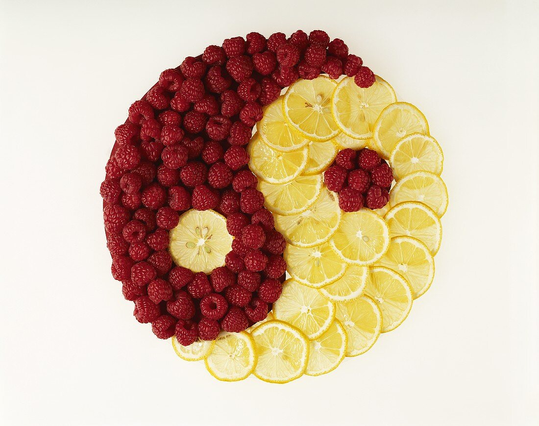 Yin yang in lemons and raspberries symbolising 'wood'