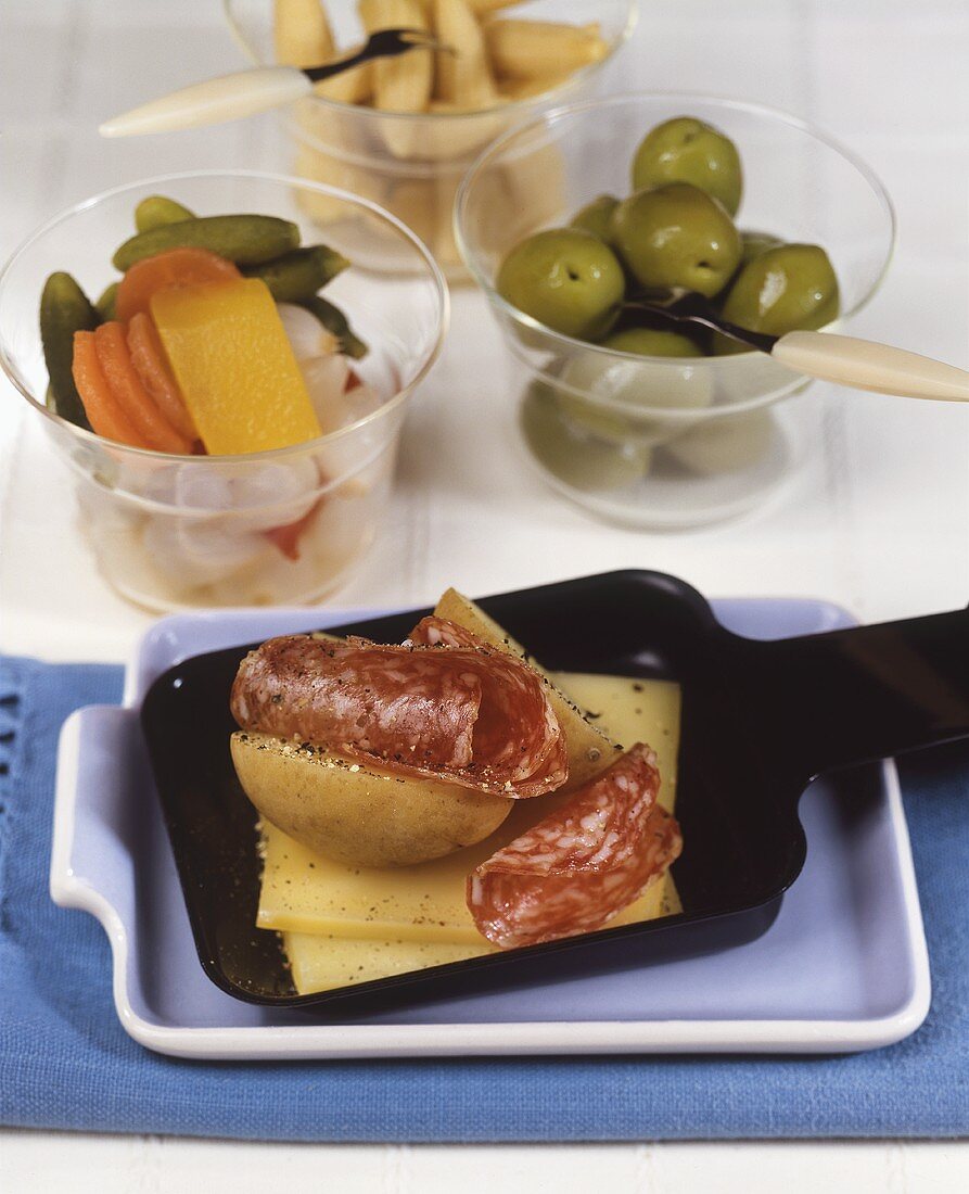 Potato and cheese raclette with sausage
