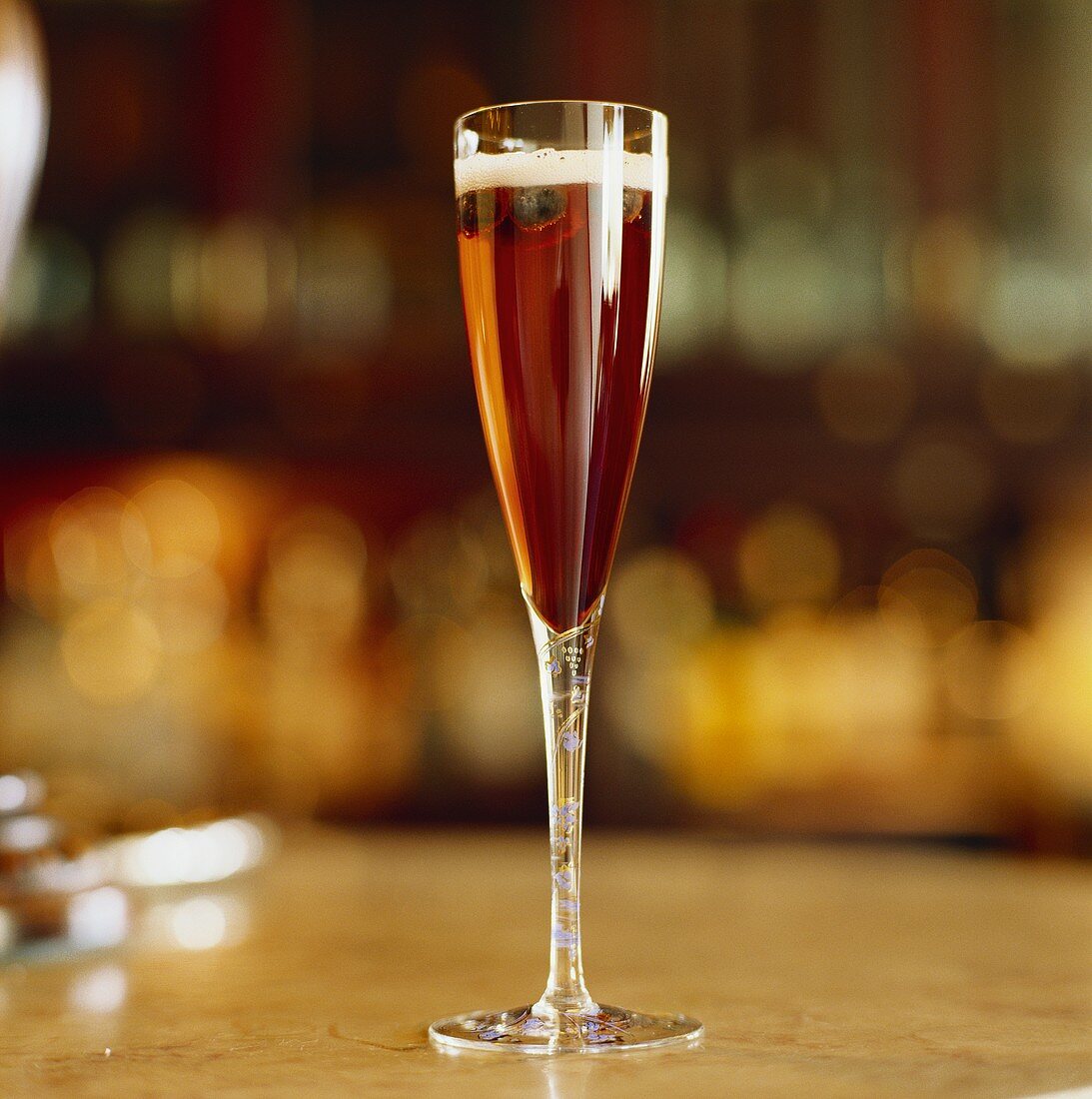 Champagne cocktail with blueberry liqueur