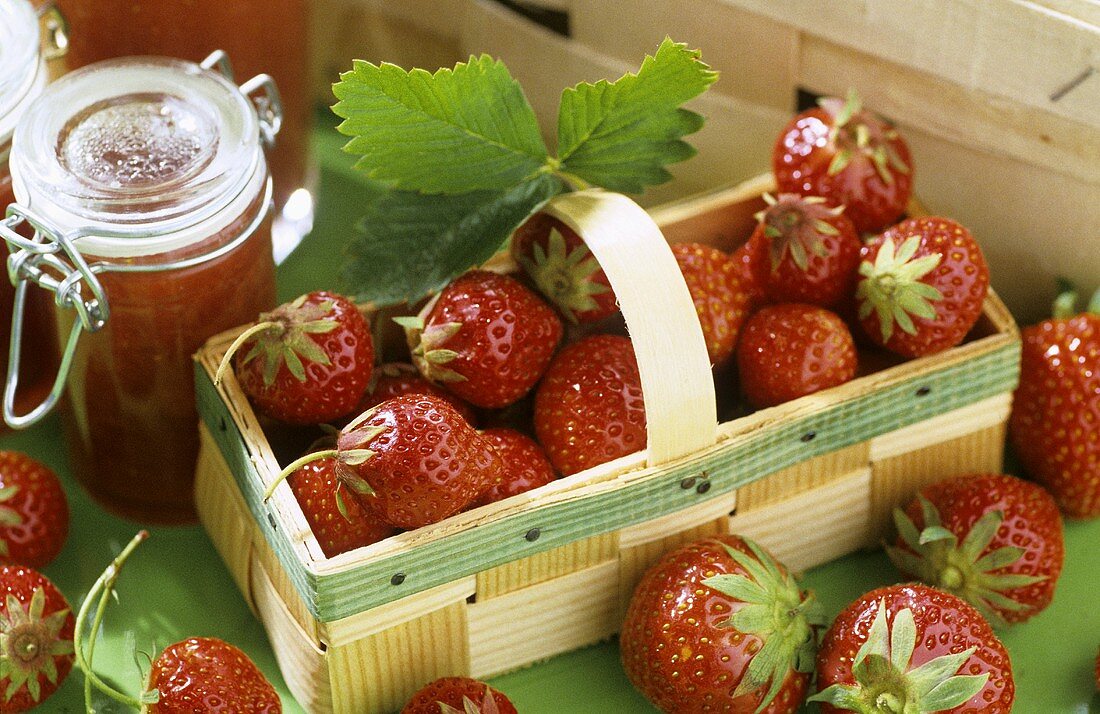 Still life with strawberries and strawberry jam