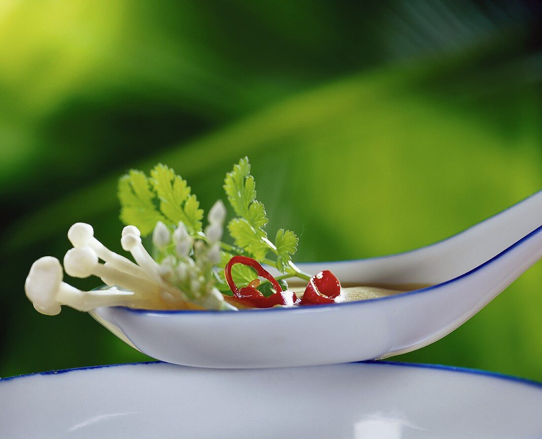 Asian soup in spoon