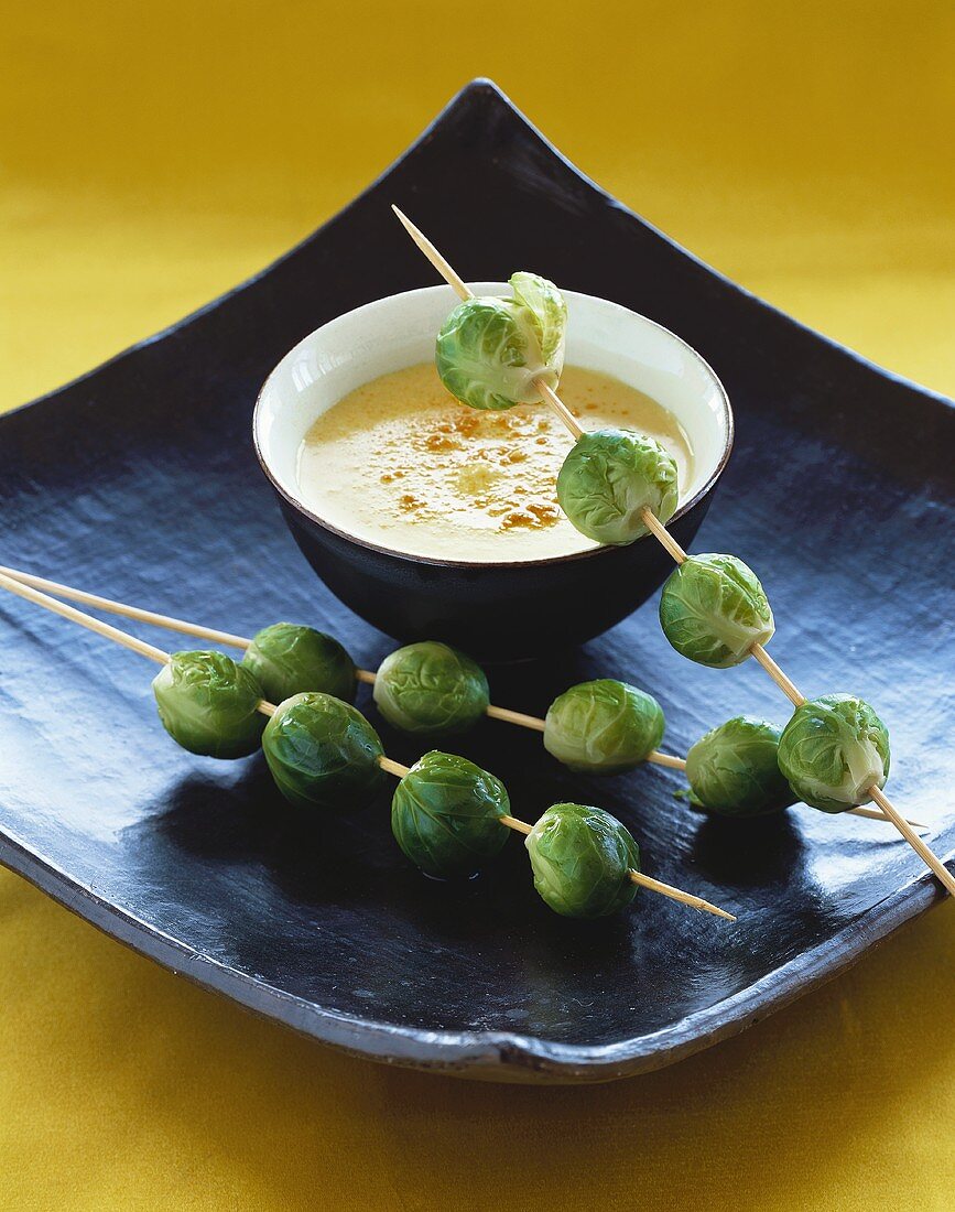 Creamed potato soup with skewered Brussels sprouts