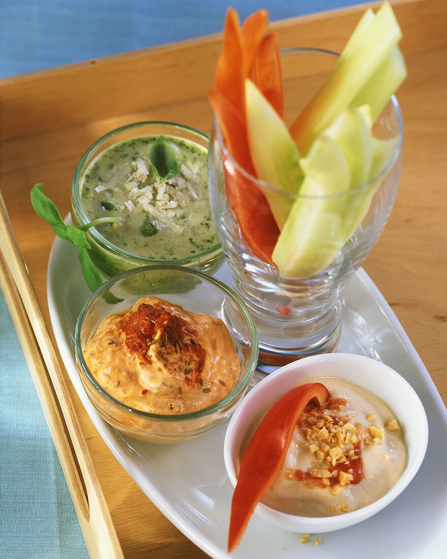 Strips of vegetables with peanut dip, cheese dip & herb dip