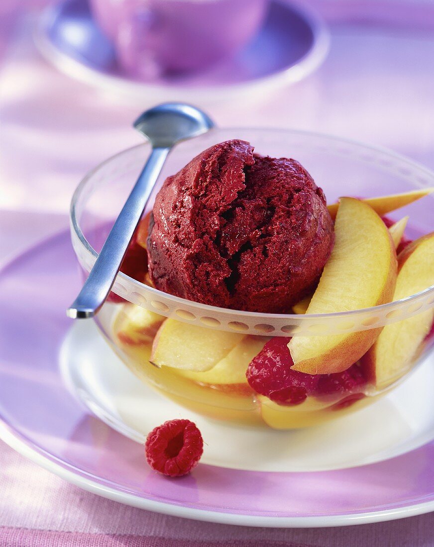 Blackberry ice cream with peach and raspberry salad