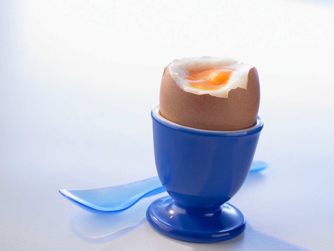 Soft-boiled egg in a blue eggcup