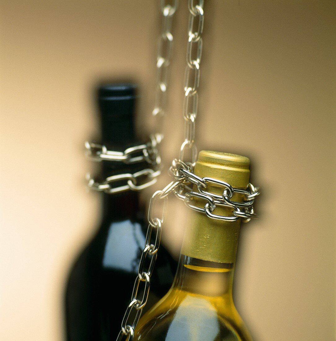 Bottle necks hanging on chains