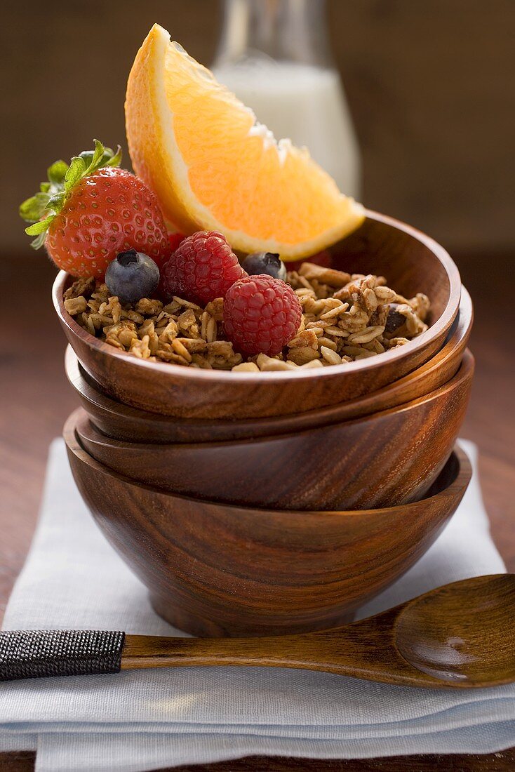 Muesli and fruit in wooden bowl