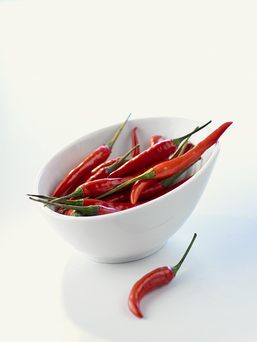 Red chili peppers in a white bowl