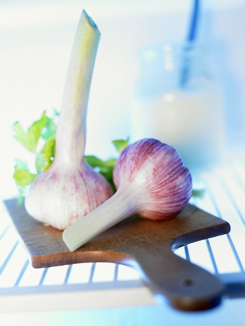Garlic bulbs on chopping board in fridge