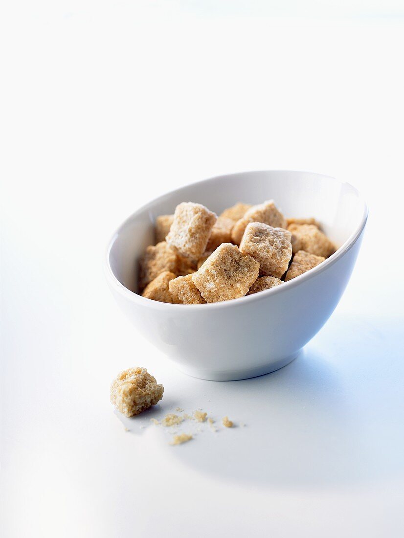 Brown sugar cubes in small bowl