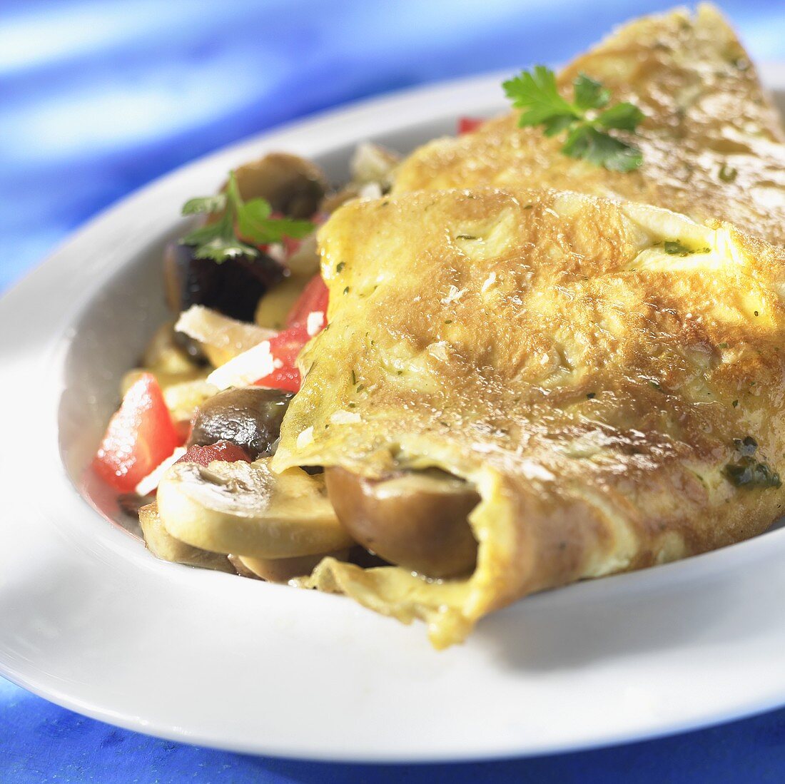 Omelette with mushroom and vegetable filling