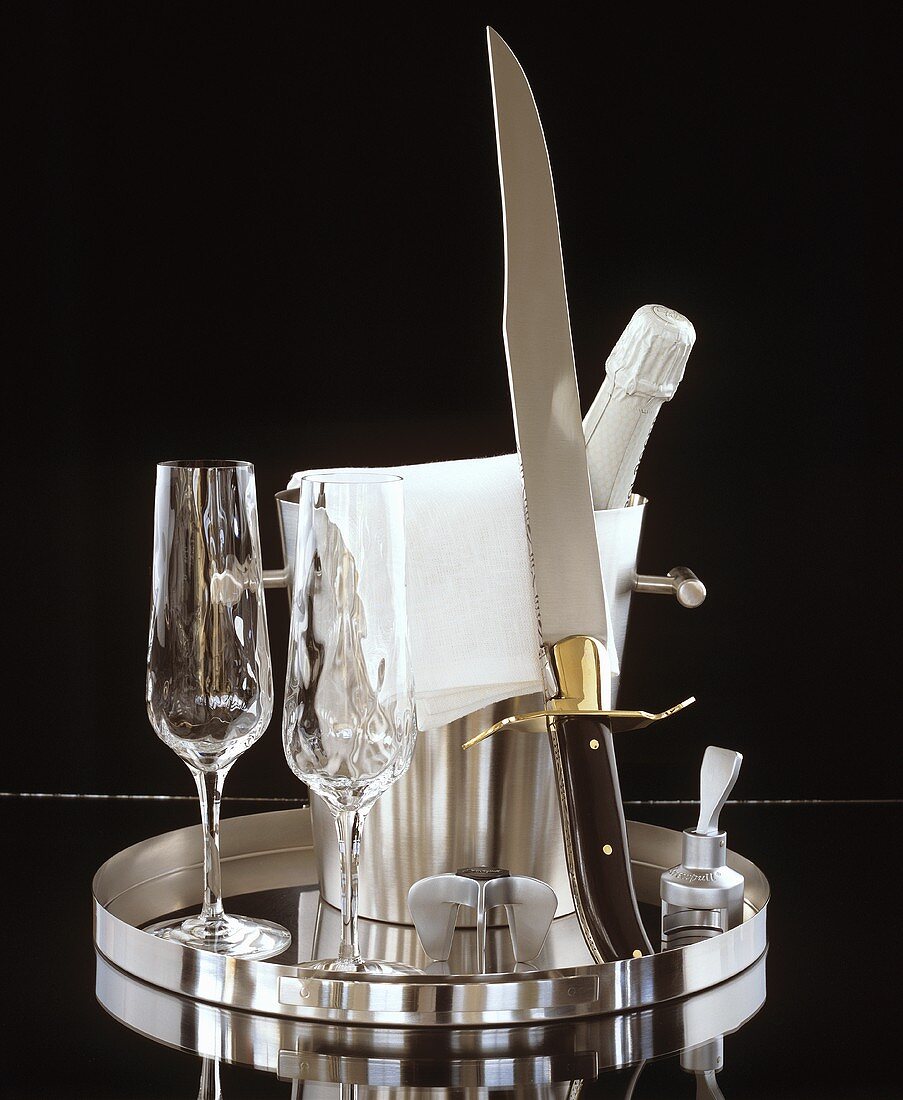 Champagne with glasses and champagne knife