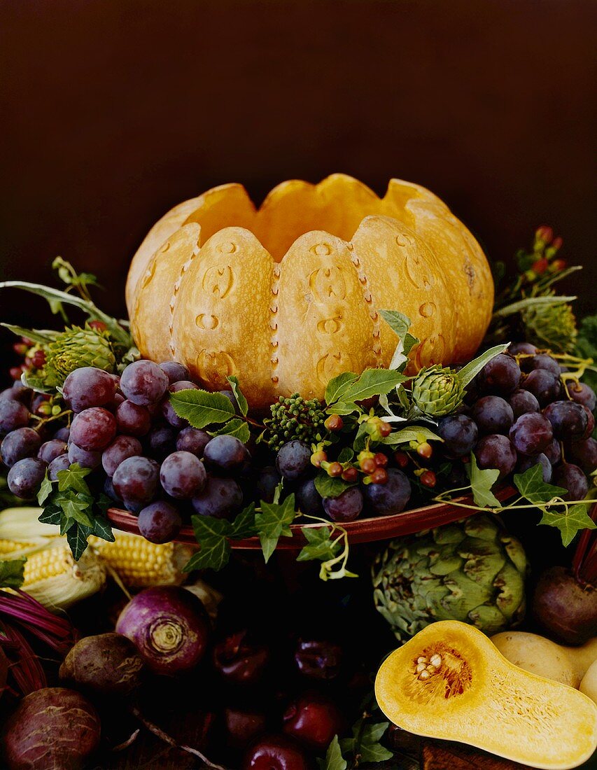 Autumn still life with pumpkin and grapes