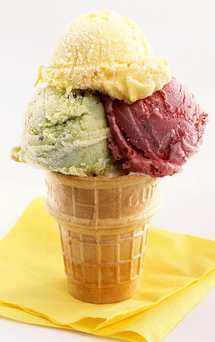 Ice cream cone with three scoops of ice cream