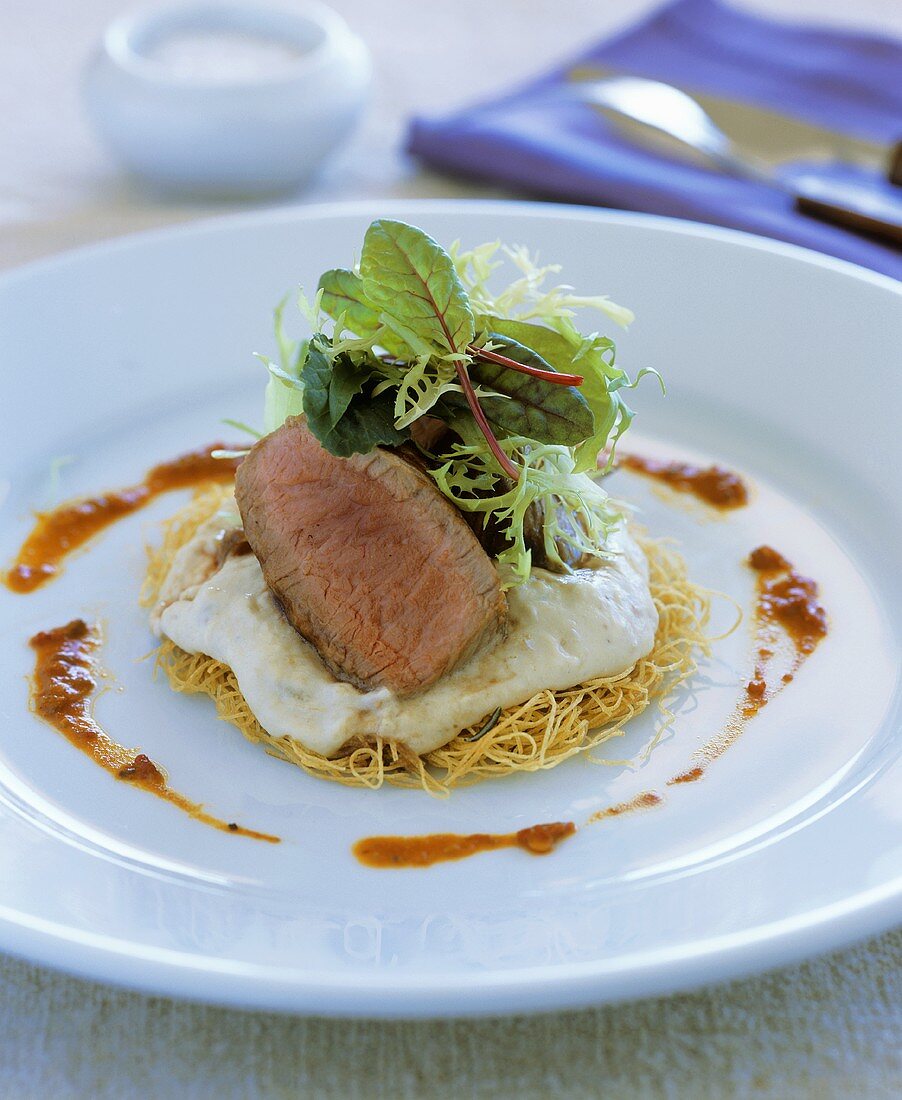 Grilled lamb fillet with baba ganoush on kataifi nest