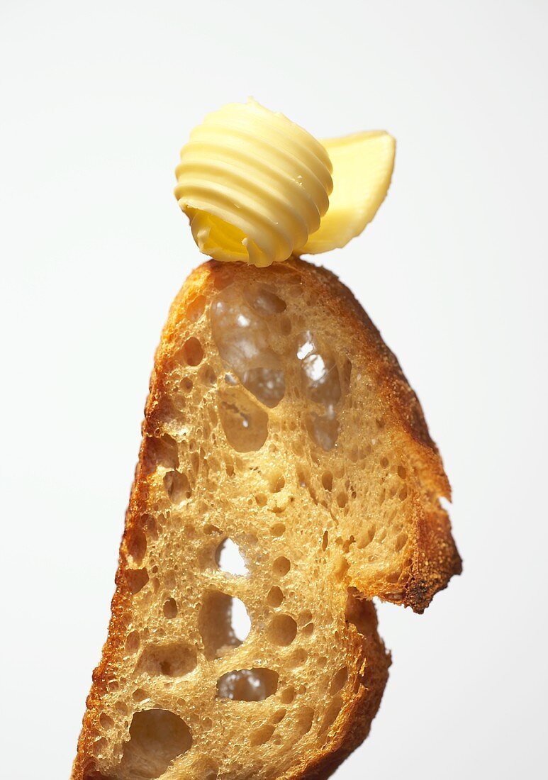 A butter curl on a slice of farmhouse bread