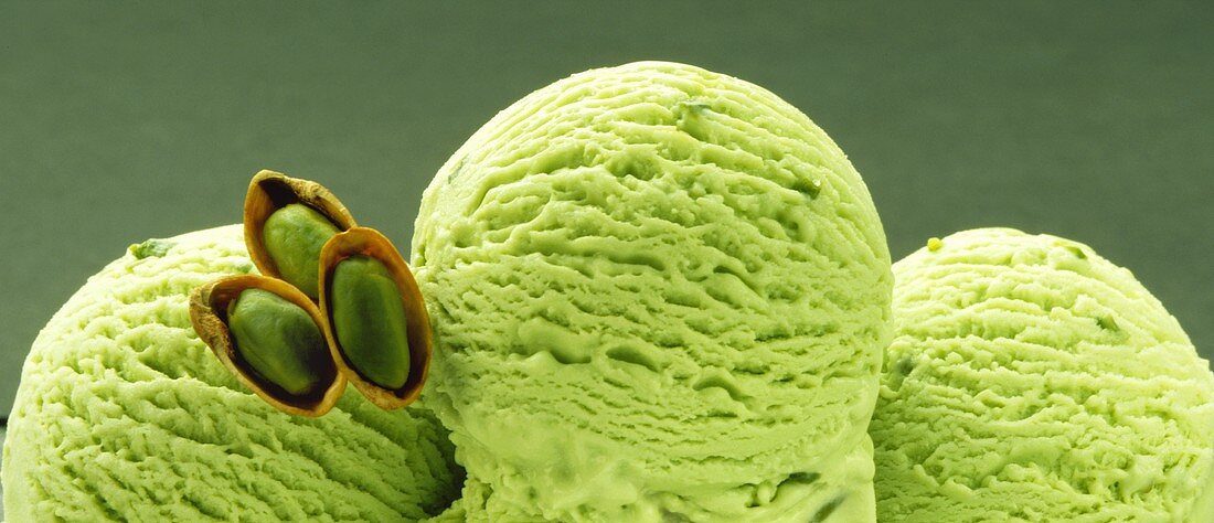 Three scoops of pistachio ice cream
