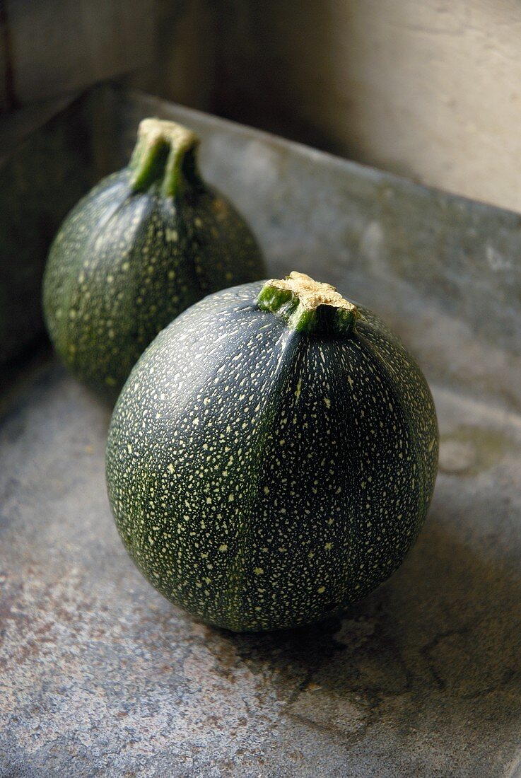 Two round courgettes